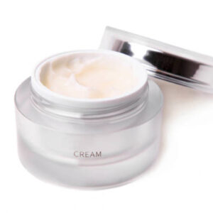 Face cream in a jar isolated on white background.